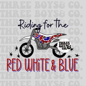 May include: A red, white, and blue dirt bike with a camouflage pattern. The bike is riding over stars and the text "Riding for the" and "RED WHITE & BLUE" is written above and below the bike. The logo "THREE BOYS & CO." is in the lower right corner of the image.