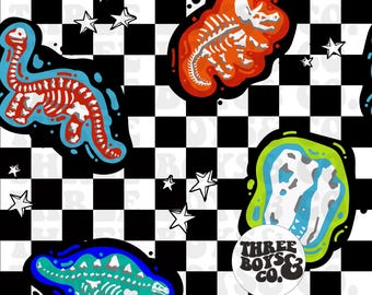 May include: A repeating pattern featuring dinosaur skeletons in red, blue, and green, set against a black and white checkered background. White stars are scattered throughout the design. A circular logo with the text "THREE BOYS & CO." is also present.