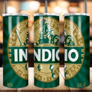 May include: A green and gold 20 fl oz. stainless steel tumbler with a design featuring the Indio beer logo. The logo includes the words "Indio", "Cerveza", "Hecho en Mexico", and "La Cosa Es Buscarle".