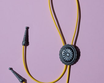 Silver Concho Bolo Tie with a yellow cord - brightly coloured cord bolo tie