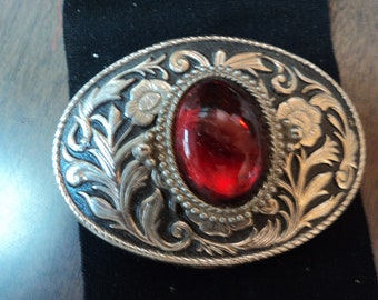 Western belt buckle-red center on silver/black background buckle-made in usa