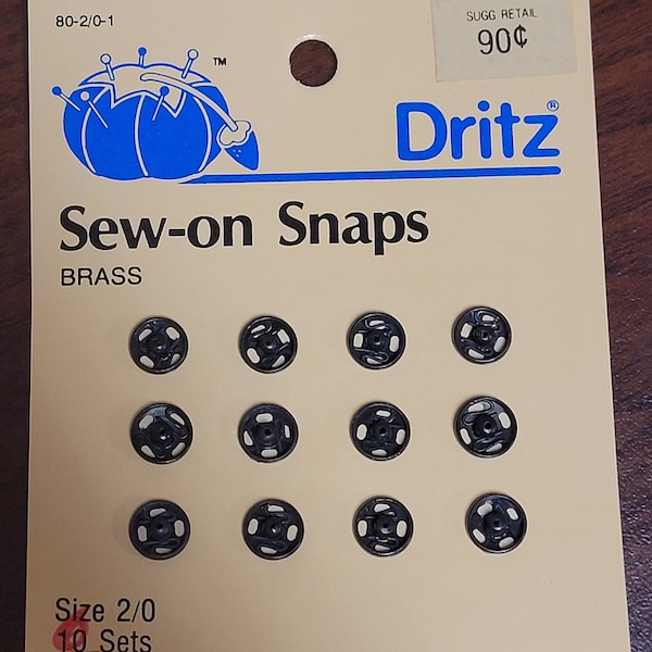 Dritz brass size 2/0 sew on snaps.  black.  12 sets.