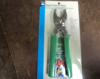 May include: Green handled snap fastener pliers with 16 snap fasteners included. The packaging says "Snap Fastener Pliers" and "Pritcz 16P Fasteners Pliers".