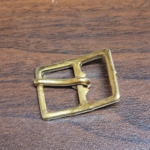 center bar buckle.  gold.  1/2".   made in usa.  1 dozen.