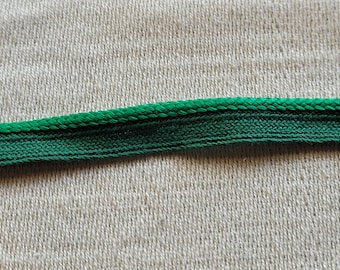 Piping cord(cordege) green, normally seen on western shirts.  1/2".  10 yards