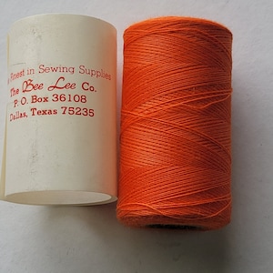polyester covered polyester thread-ORANGE.  1,000 yard spool.  made in the usa.