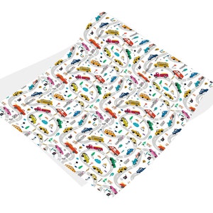 May include: A white wrapping paper with a repeating pattern of colorful cars, trucks, and buses driving on winding roads. The pattern includes small details like trees, streetlights, and puddles.