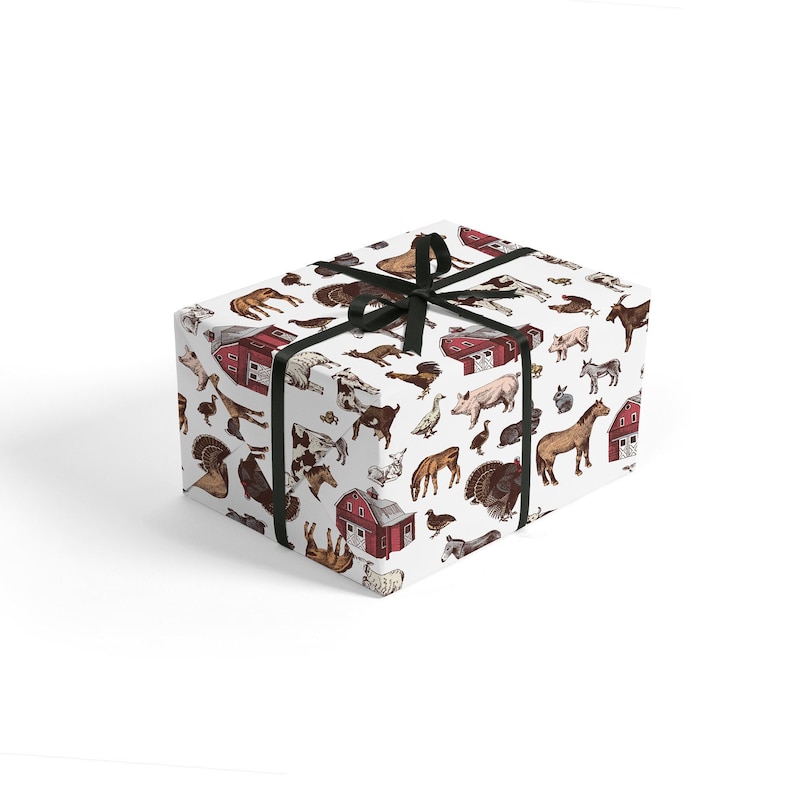 May include: White gift wrap with a black ribbon and a repeating pattern of farm animals and red barns. The animals include cows, pigs, chickens, turkeys, horses, and sheep.