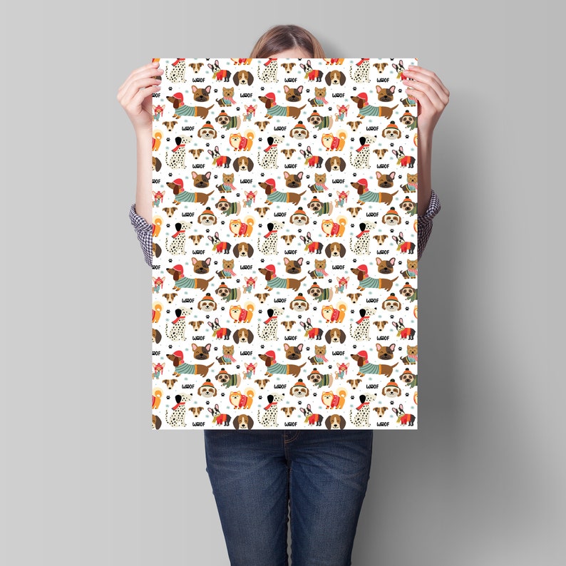 May include: A white poster with a repeating pattern of various dog breeds wearing winter clothing. The dogs are in different poses and colors, with the word "Woof" appearing throughout the design. The dogs are wearing hats, sweaters, and scarves.
