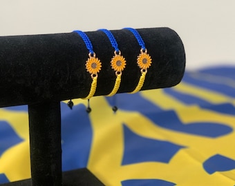Handmade adjustable bracelet. Ukrainian flag colors with sunflower charm. Support Ukraine, stand with Ukraine.