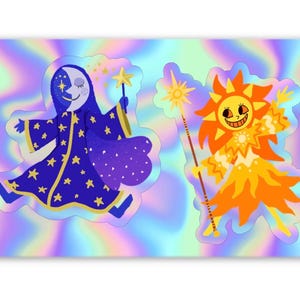 May include: Two stickers featuring whimsical celestial characters. One depicts a blue moon wizard with a star wand, the other a smiling orange sun figure with a staff. Both are set against a holographic background, perfect for decorating laptops, water bottles, or notebooks.