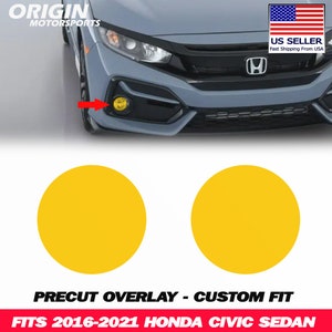 May include: Two yellow precut overlay decals for a Honda Civic Sedan. The decals are designed to fit the 2016-2021 model years. The image shows a blue Honda Civic Sedan with the decals installed on the front fog lights.
