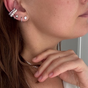 Bijou d'oreille en forme de conque en nacre naturelle/argent 2525