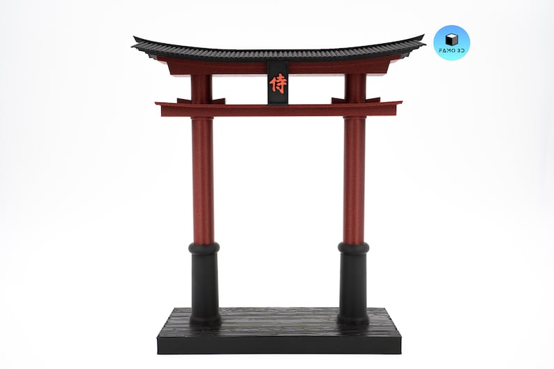 May include: A miniature red and black Torii gate, a traditional Japanese Shinto shrine gate. The gate features two vertical pillars, a horizontal beam, and a curved top. The word "侍" is displayed on the top. The gate is mounted on a black base.