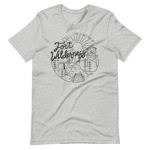 May include: A gray t-shirt with a black and white illustration of a campsite with the text "Life is better at Fort Wilderness".