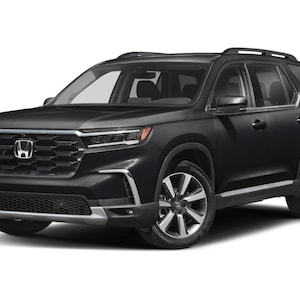 May include: A black SUV with silver alloy wheels. The vehicle has a prominent front grille with the Honda logo and sleek headlights. The car is parked on a white background.