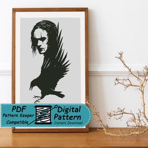 May include: A framed cross-stitch pattern featuring a black silhouette of a crow with the face of a person with long hair and dark eye makeup. The design is set against a light gray background. A teal banner at the bottom reads PDF Pattern Keeper Compatible Digital Pattern Instant Download.