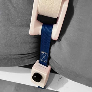 Lockable tension strap adapter