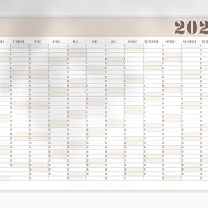 May include: A yearly wall calendar for 2026, featuring a neutral color scheme. The calendar is organized with monthly columns and daily rows, providing a clear and organized layout for scheduling and planning. The year 2026 is displayed at the top.