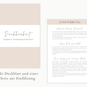 May include: A journal with a beige cover and a white band featuring the word "Dankbarkeit" in elegant script, with the subtitle "Kognitive Entlastung & Klarheit." The journal's introduction page is also visible.