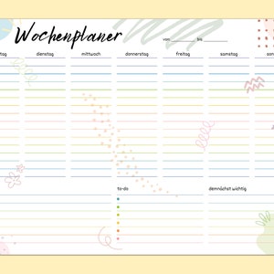 May include: A weekly planner with a white background and colorful abstract designs. The planner has sections for each day of the week, from Monday to Sunday. It also includes sections for notes, to-do list, and things to do soon.