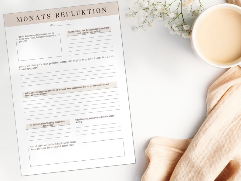 May include: A printable monthly reflection worksheet in German with the title "Monats-Reflektion" and prompts for reflection on the month, including favorite moments, challenging situations, and self-care practices.
