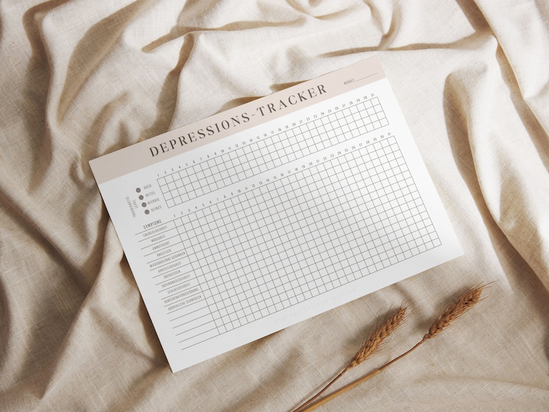 May include: A printable depression tracker with a grid for tracking symptoms over 30 days. The tracker includes a list of symptoms such as fatigue, insomnia, and appetite changes.