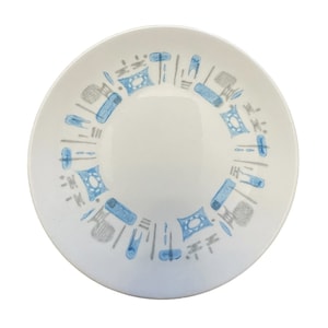May include: A white ceramic plate with a blue and gray geometric pattern around the rim.