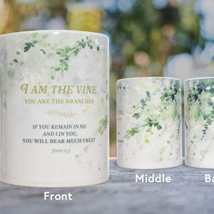 May include: White ceramic mug with a green watercolor vine design. The mug features the text "I am the vine, you are the branches. If you remain in me and I in you, you will bear much fruit. John 15:5".