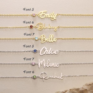 May include: Six gold and silver necklaces with different fonts and gemstones. The names Emily, Blakeyo, Bella, Chloe, Melanie, and Rachet are spelled out on the necklaces.