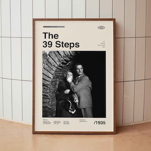May include: A black and white poster for the 1935 Alfred Hitchcock film "The 39 Steps". The poster features a scene from the film with a man and a woman in a dark, shadowy setting. The text on the poster reads "The 39 Steps", "An Alfred Hitchcock Film", and "1935".