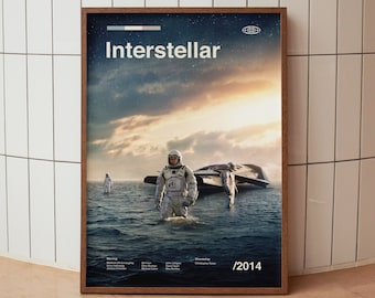 May include: A movie poster for the film "Interstellar" featuring a scene of astronauts in space suits standing in water with a spaceship in the background. The poster has the title "Interstellar" and the year "2014" printed on it.