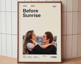 May include: A framed movie poster for "Before Sunrise" with a beige background. The poster features a couple embracing, with the title in bold black text. The year 1995 is displayed at the bottom right.