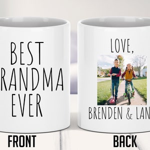 May include: White ceramic mug with the text "Best Grandma Ever" on the front and a photo of two children on scooters with the text "Love, Brenden & Lana" on the back.