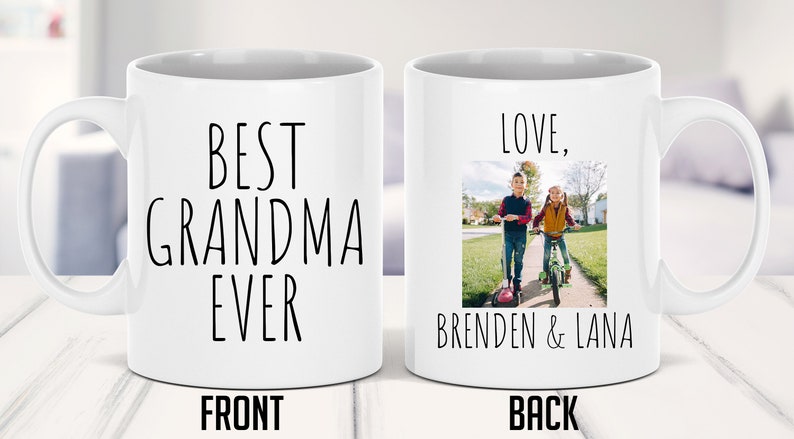 May include: White ceramic mug with the text "Best Grandma Ever" on the front and a photo of two children on scooters with the text "Love, Brenden & Lana" on the back.