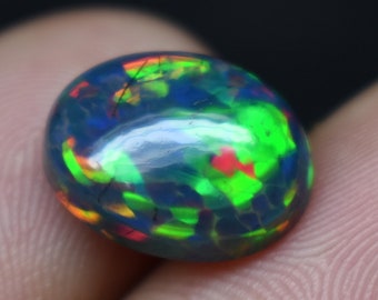 Ópalo etíope negro Galaxy Fire de 4 quilates, cabujón ovalado (13,5 x 10,6 x 5,9 mm)