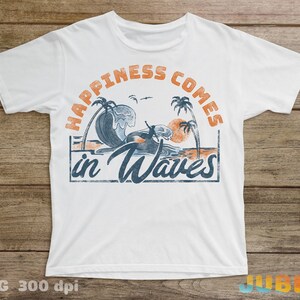May include: White t-shirt with a vintage-style graphic design. The graphic features a surfer riding a wave with palm trees and a sunset in the background. The text "Happiness Comes in Waves" is printed in a distressed font.