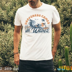 May include: White t-shirt with a graphic print of palm trees, waves, and the text "Happiness Comes in Waves".