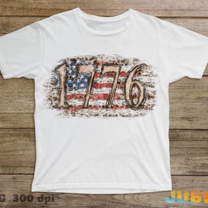 May include: White t-shirt with a distressed American flag design and the number 1776.