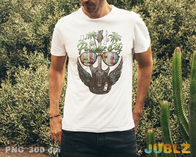 May include: White t-shirt with a graphic of a guitar wearing sunglasses and the text "Paradise City".