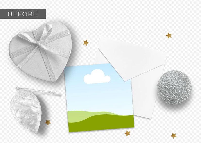 May include: A white card with a blue sky and green hills, a white envelope, a silver heart-shaped box with a white ribbon, a silver ornament shaped like a pine cone, and a silver ball ornament. There are gold stars scattered around the objects.