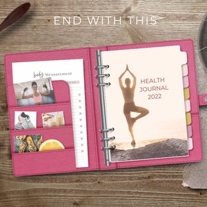 May include: Pink leather bound journal with a silhouette of a person doing yoga on the cover. The text "HEALTH JOURNAL 2022" is printed on the cover. The journal has pockets on the inside cover for storing photos and other items.