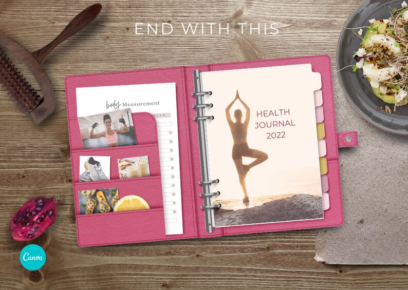 May include: Pink leather bound journal with a silhouette of a person doing yoga on the cover. The text "HEALTH JOURNAL 2022" is printed on the cover. The journal has pockets on the inside cover for storing photos and other items.