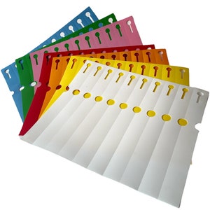 May include: A set of colourful, blank, paper wristbands with pre-punched holes for attaching to a person's wrist. The wristbands are arranged in a fan shape, with the white wristbands on top and the other colours underneath. The colours are blue, green, pink, red, orange, yellow, and white.