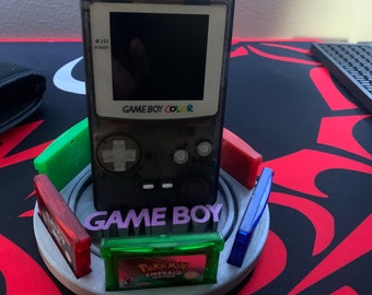 Rotating gameboy color stand, holds SIX games.(games NOT included)