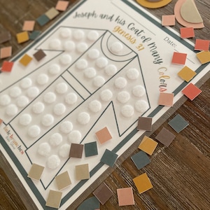 May include: A printable activity for children featuring a coat outline with white circles and a variety of colourful squares and semi-circles to be placed on the coat. The title of the activity is "Joseph and his Coat of Many Colours" with the scripture reference "Genesis 37".