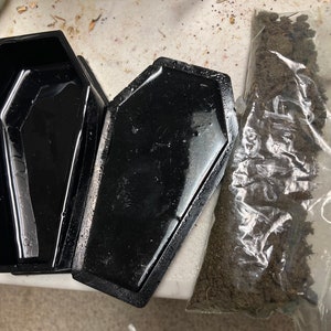 Graveyard dirt / Asylum dirt + black resin / wooden coffin; hand-sifted dirt, no fillers/rocks, From a soldier’s grave / a psych hospital