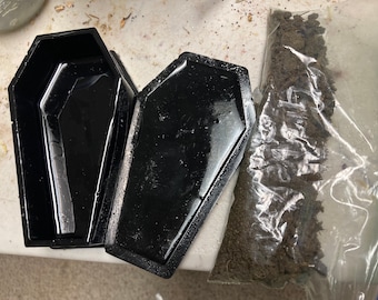 Graveyard dirt + black resin / wooden coffin; hand-sifted dirt, no fillers/rocks/twigs, From a soldier’s grave