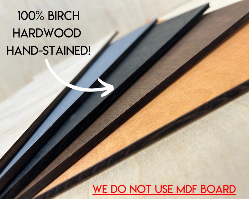 May include: Close-up of five different wood panels, each stained a different color. The panels are stacked on top of each other, with the lightest color on top and the darkest color on the bottom. The text "100% BIRCH HARDWOOD HAND-STAINED!" is visible at the top of the image. The text "WE DO NOT USE MDF BOARD" is visible at the bottom of the image.