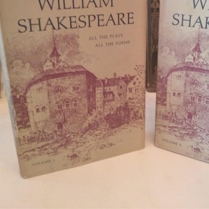 May include: Two vintage hardcover books titled "The Complete Works of William Shakespeare" with a drawing of a building on the front cover. The book on the left is volume one and the book on the right is volume two.